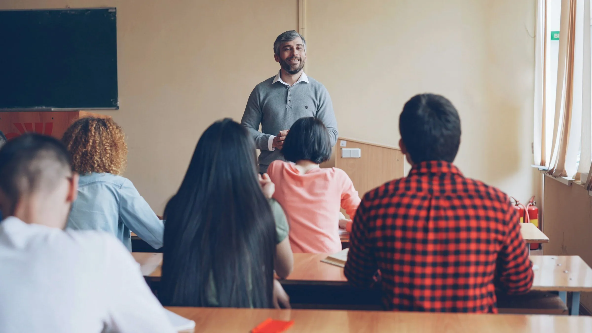 An instructor teaching a class of adult students
